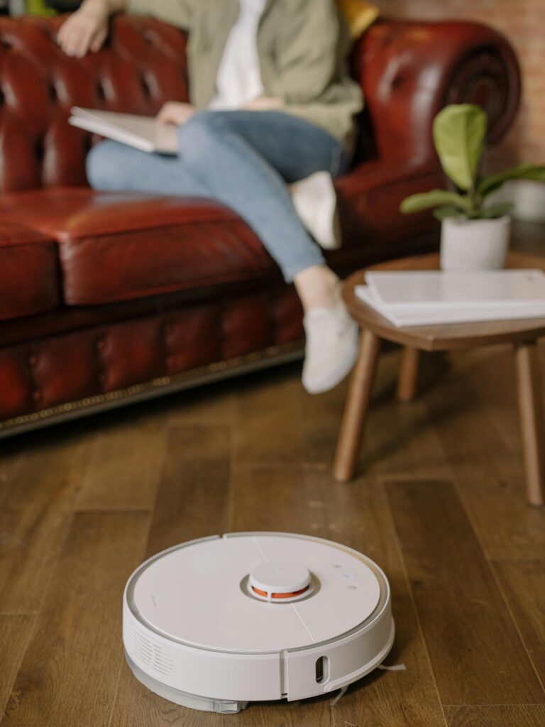 Robot vacuum cleaning floor in a modern living room