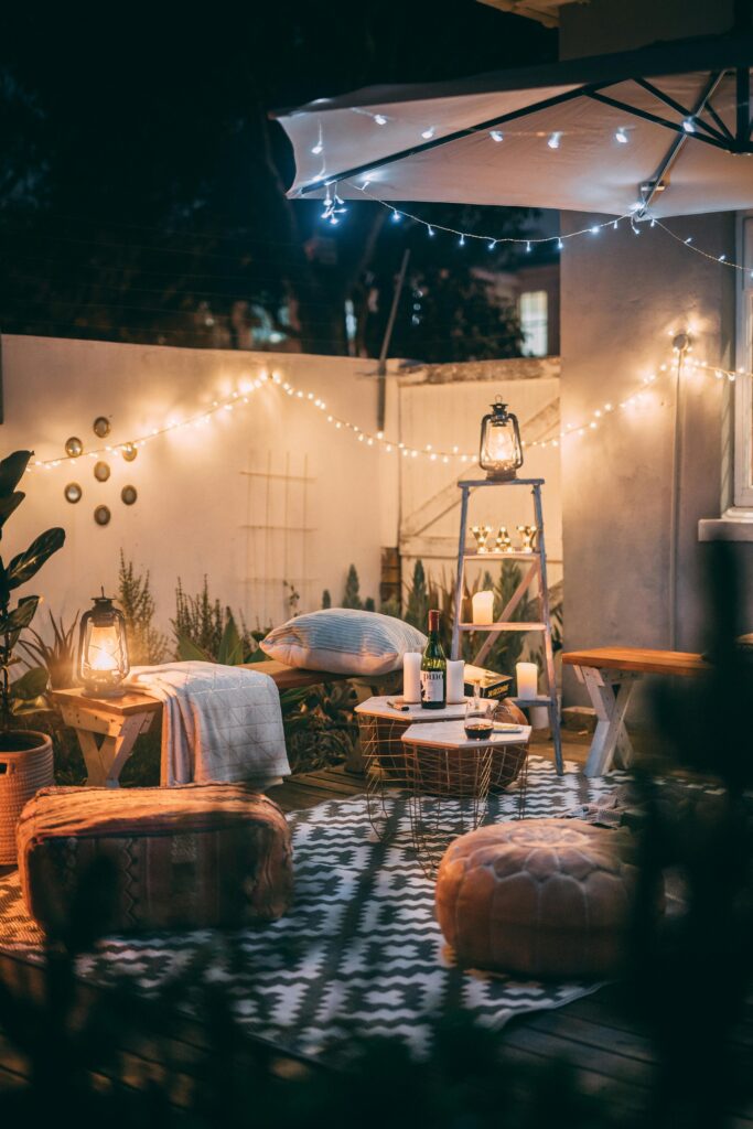 small backyard with outdoor string lights at night