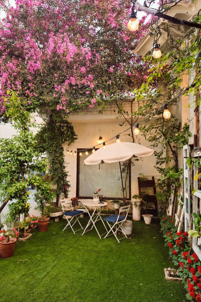 Small backyard patio ideas on a budget with string lights and cozy seating